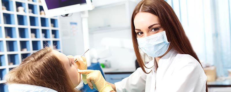 Dentist examining a prospective implant patient