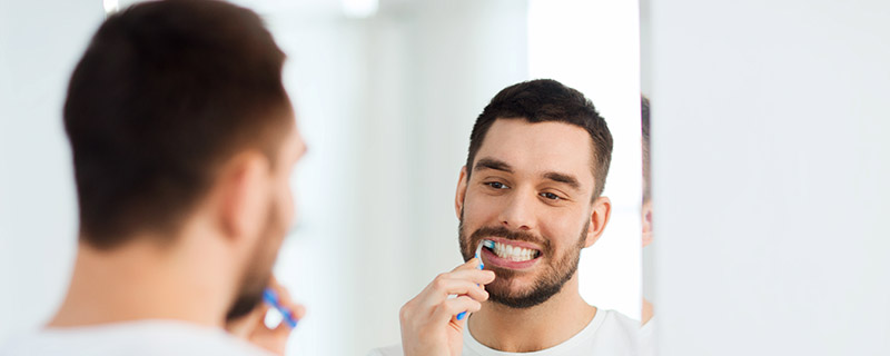 Man Brushing His Teeth