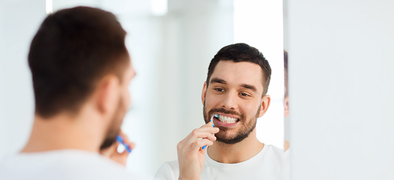 Man Taking Care of his Teeth