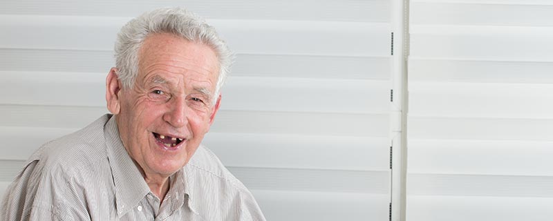 Old man missing a tooth